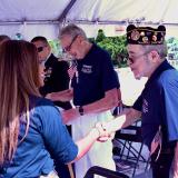 Congresswoman Sheila Cherfilus-McCormick and a veteran