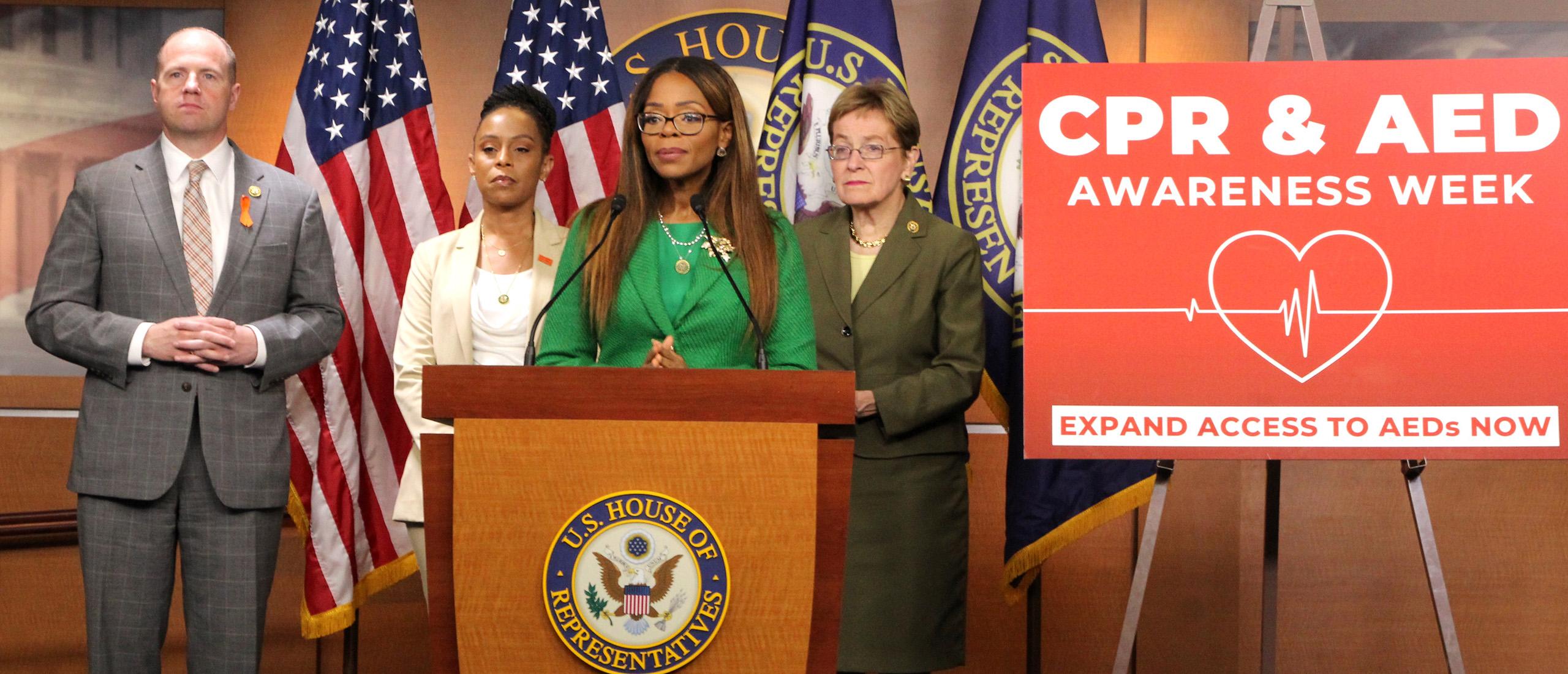 Standing at podium